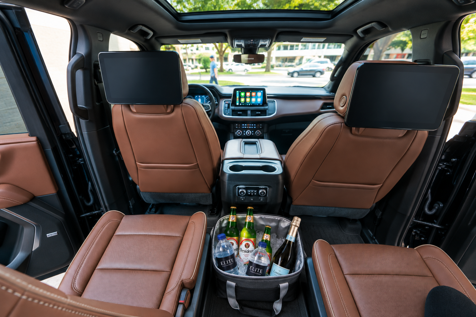 Luxury SUV interior with Elite water, Presidente beer and sparkling wine in an ice cooler